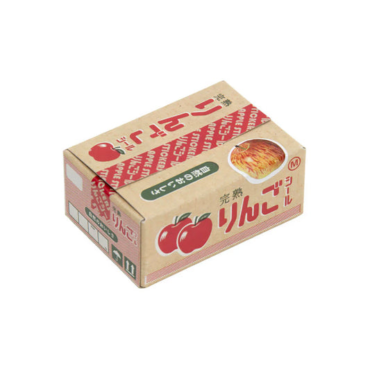 Cardboard box with Japanese text and apple graphics on a white background