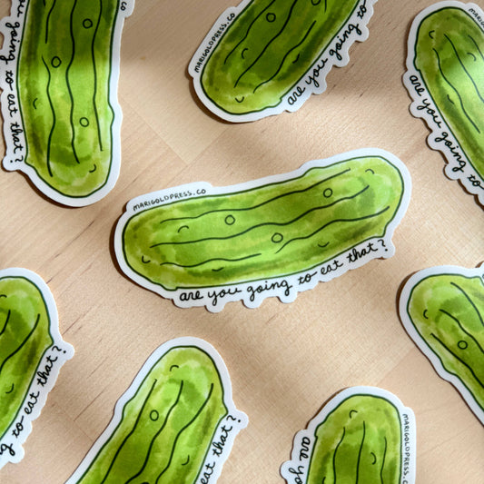 Green pickle-shaped stickers with text "are you going to eat that?" on a beige background