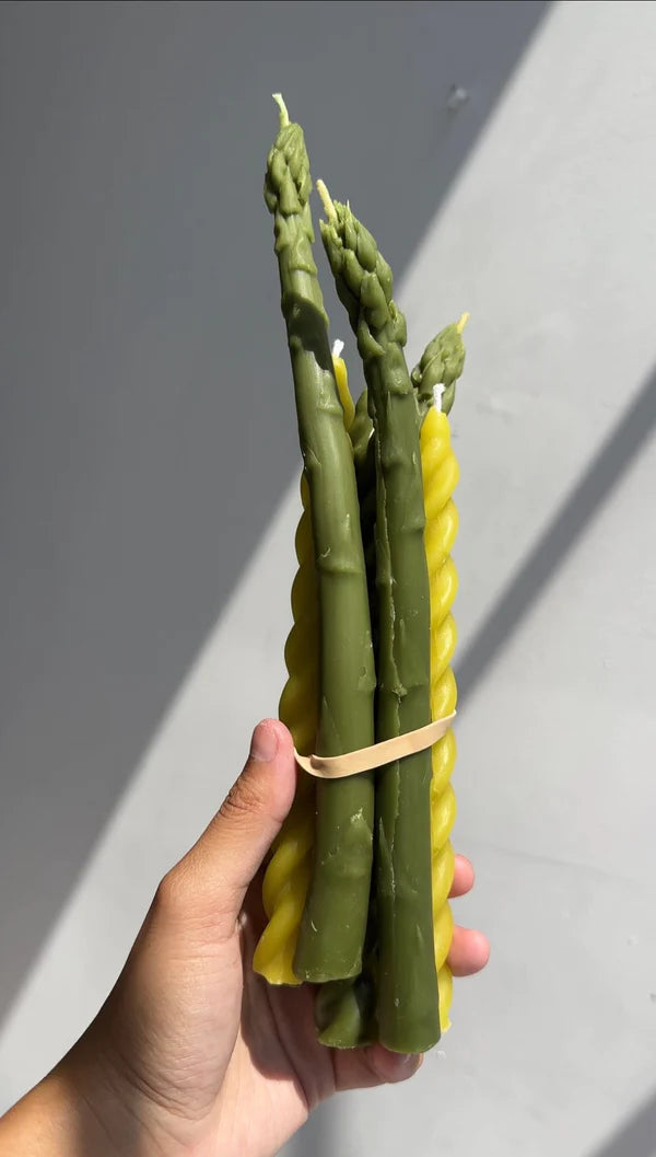Green tapered candles that look like stalks of asparagus