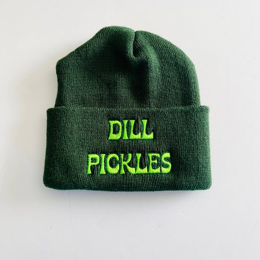 Dark green knit beanie hat with "Dill Pickles" embroidered in neon green font.
