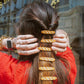 6 baguette hair clips on a woman's ponytail 