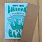 Birthday card with baja blast cups design and brown envelope on a wooden surface