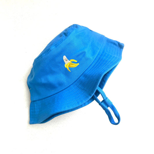 Blue bucket hat with an embroidered banana logo on a white background