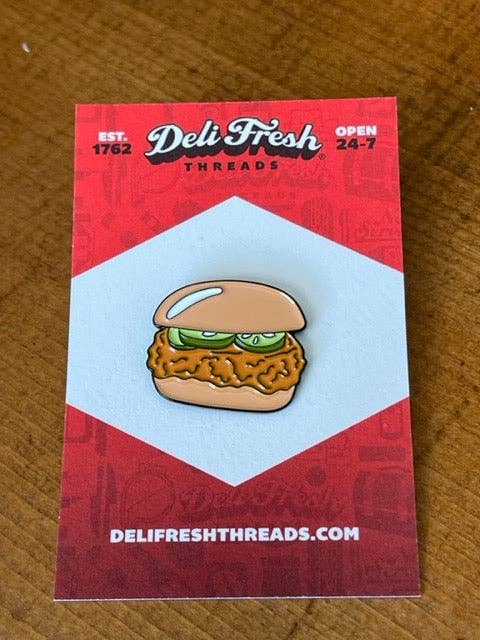 Chicken sandwich lapel pin with 3 pickles on a card backing that says Deli Fresh