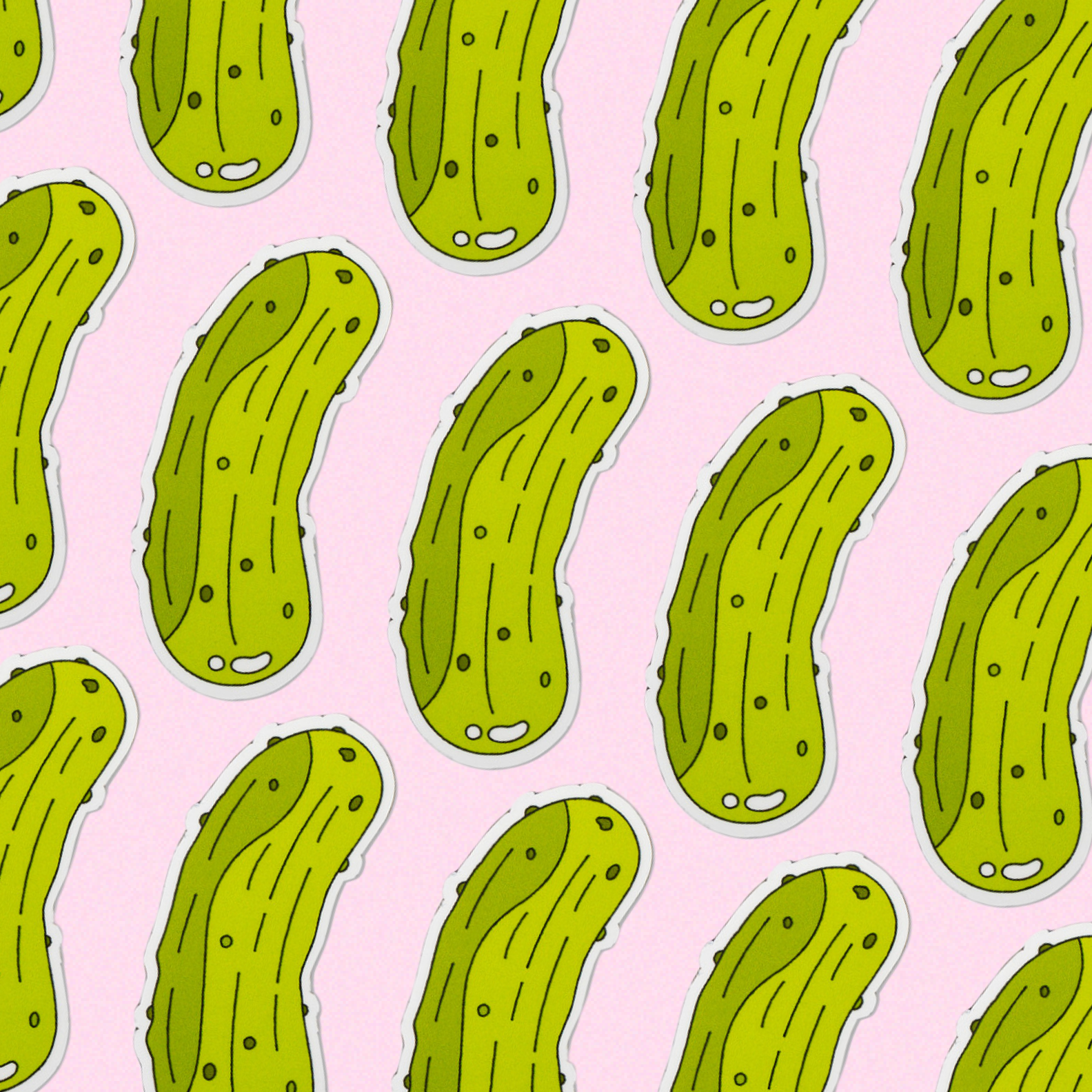 Pattern of green pickle magnets on a pink background