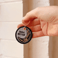 a GIF showcasing both sides of the been better keychain
