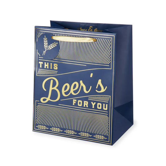 This Beer's for You gift bag. Navy bag with gold foil and art deco design. Embellished with hops. Gold ribbon handles and little gift tag attached.