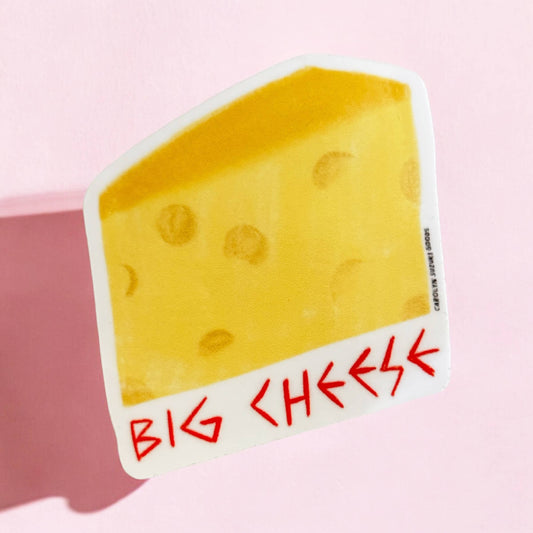 sticker of a slice of cheese with text in red at bottom that reads "big cheese" 