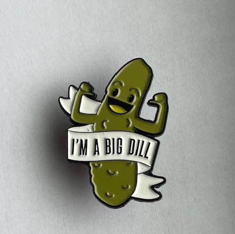 Enamel pin of a dill pickle flexing it's muscles. Text on a white banner reads "I'm A Big Dill" 