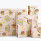 Birthday Cake Gift Bag shown in multiple sizes.  Illustration on bag features cupcakes and slices of colorful layer cake with lots of sprinkles. Multiple areas of text read "Make a WIsh!" and "Wishing you a very Happy Birthday" in gold script.