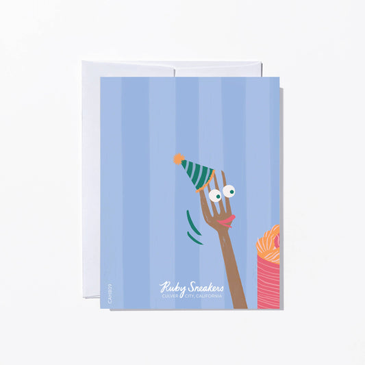 Greeting card with a cartoon fork wearing a hat on a light blue background.