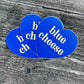 Three, blue, heart-shaped stickers with text in center that says "blue cheese" 