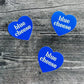 Three, blue, heart-shaped stickers with text in center that says "blue cheese" 