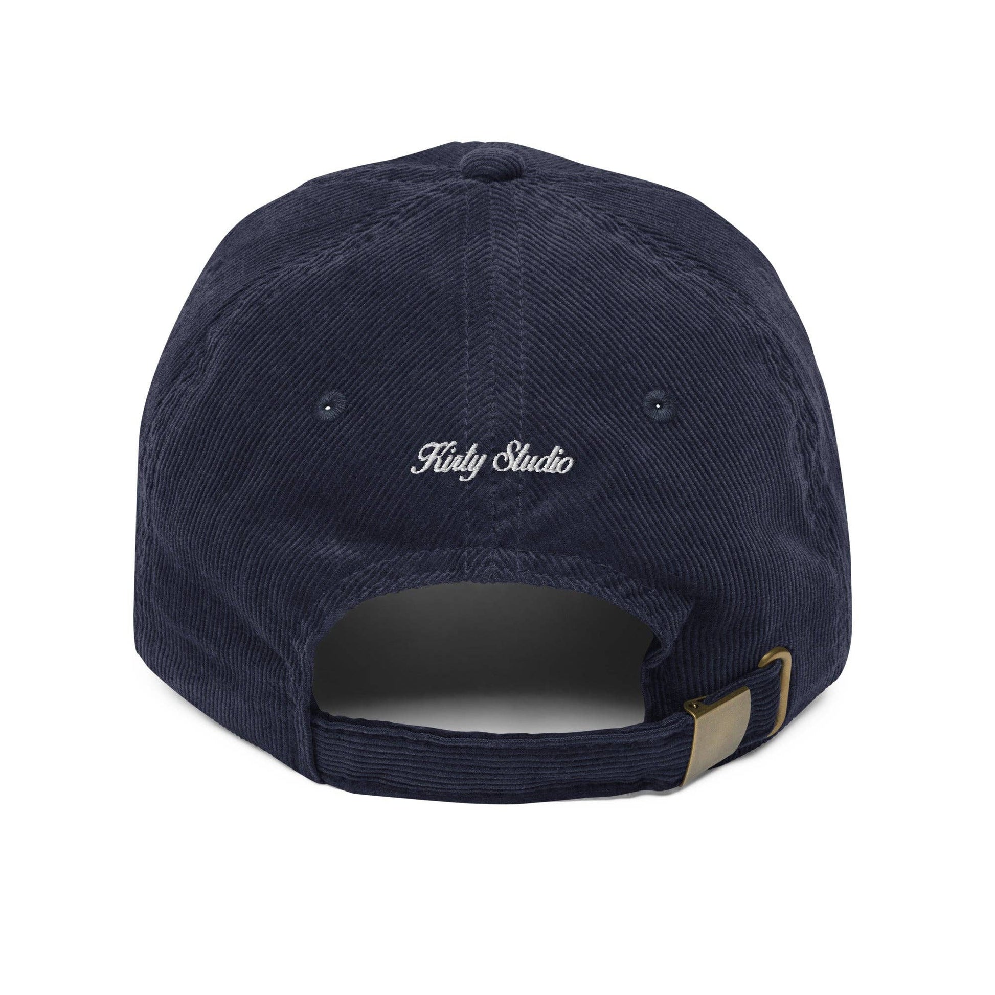 Navy blue cap with 'Kirty Studio' logo on a white background