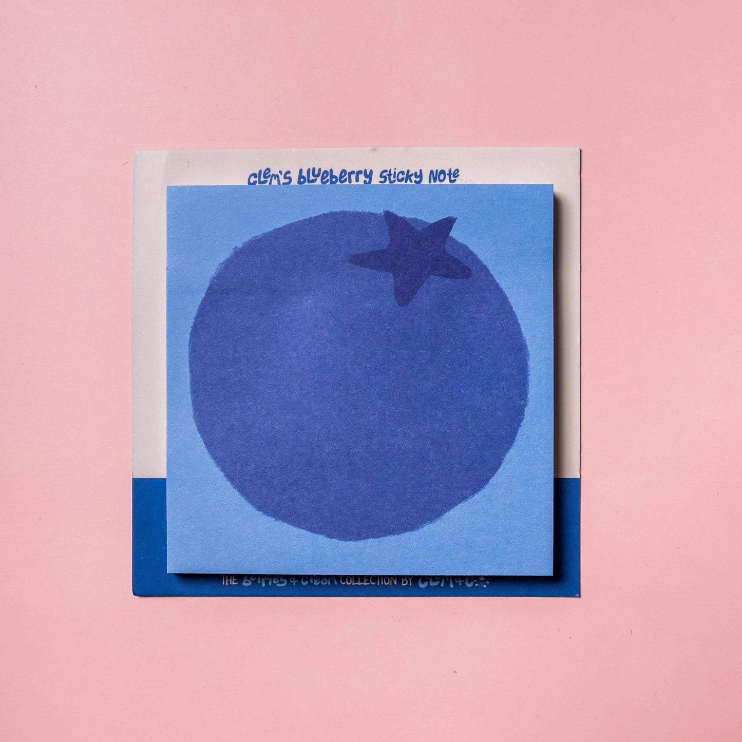 Blueberry sticky note on a pink background