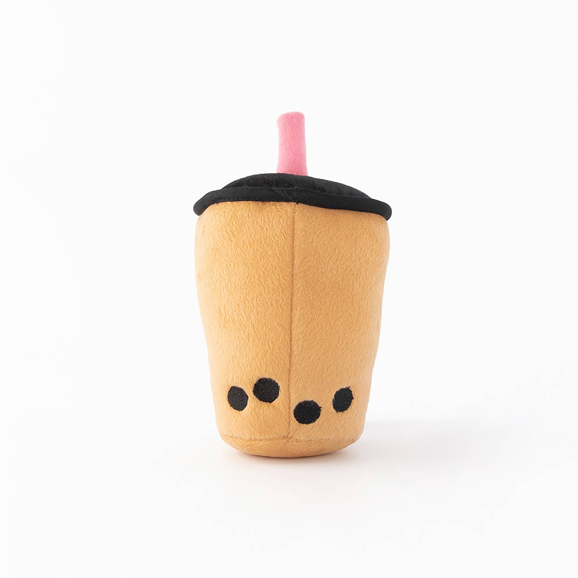 Plush dog toy resembling a bubble tea cup with a black lid and pink straw on a white background