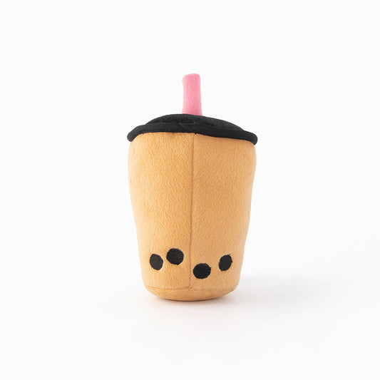 Plush dog toy resembling a bubble tea cup with a black lid and pink straw on a white background