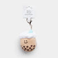 Boba plush keychain with a teal colored straw 