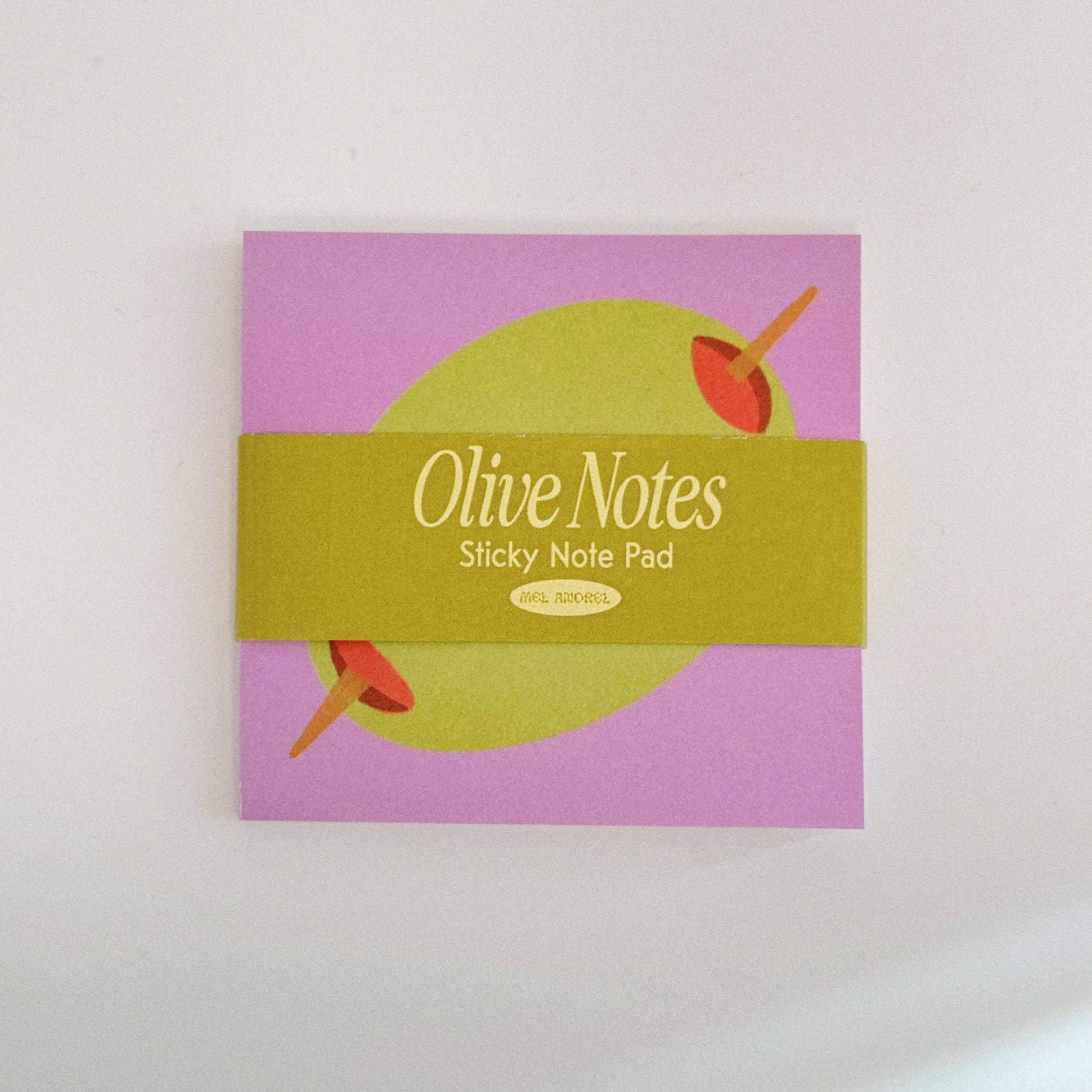 new design of the original olive sticky notes, this time in a brighter colorway. Pink background with a stuffed green olive