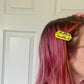 Single butter clip in person's hair 