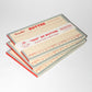 stack of list style notepad designed to look like outer wrap on stick of butter 