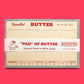 Large list style notepad designed to look like outer wrap on stick of butter 