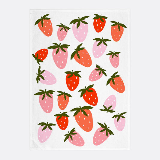 White kitchen towel with pink and red strawberries on it 