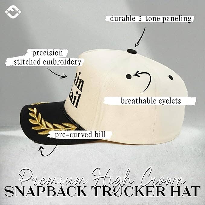 Beige and black snapback hat with text highlighting features on a gray background
