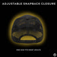 Black mesh cap with adjustable snapback closure on a dark background