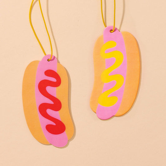 Double sided car air freshener made to look like a hot dog. One side has mustard, the other ketchup. 
