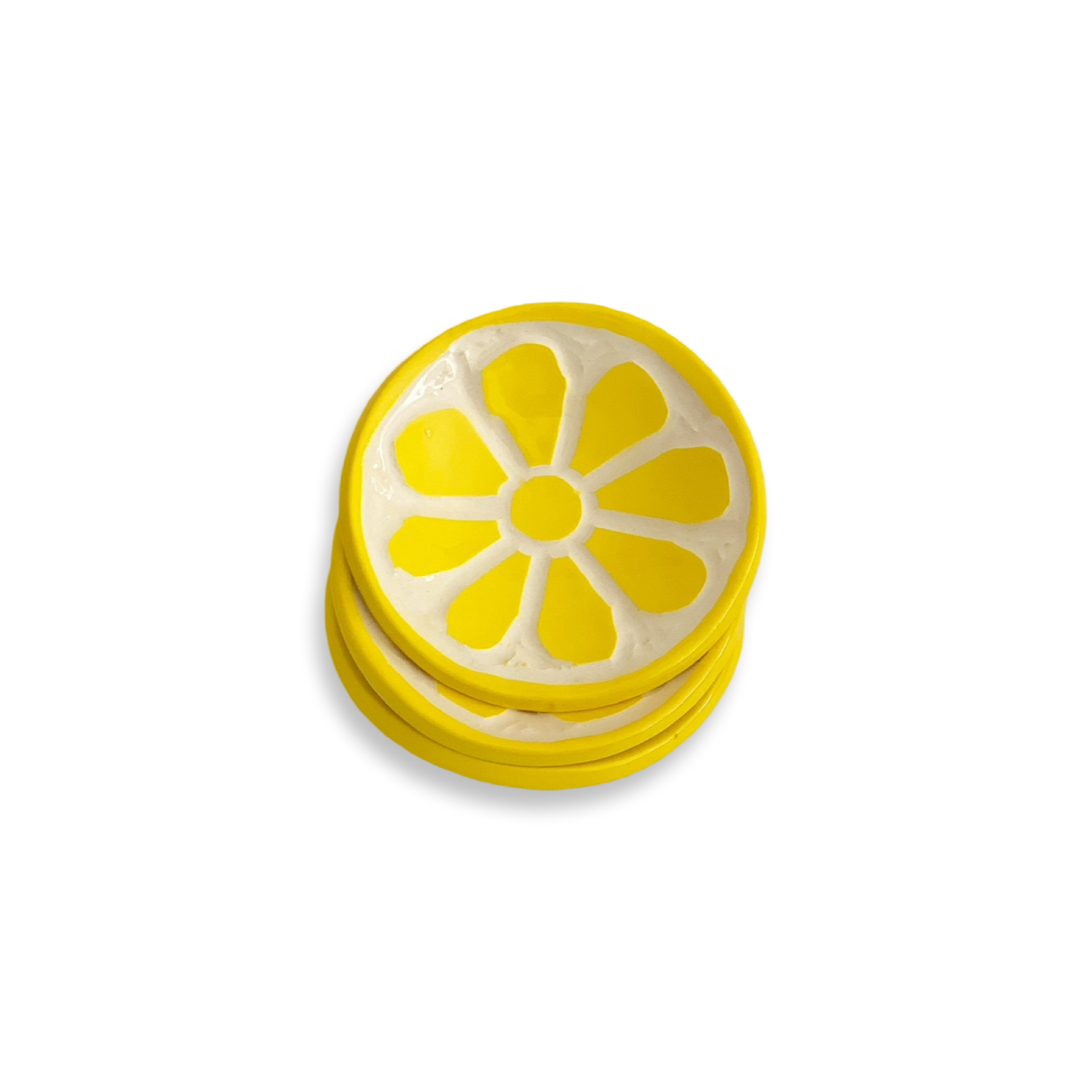 Stack of yellow lemon trinket trays on white background