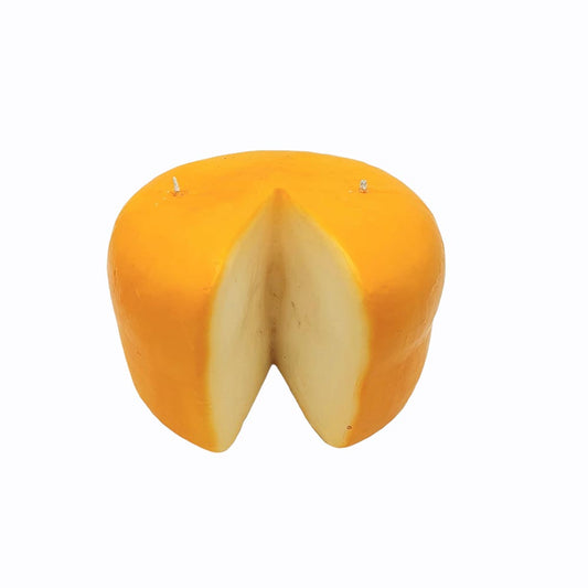 Candle that looks like a wheel of pecorino cheese. Has a wedge cut out of the wheel with two wicks on top -- one on far right and the other far left. 