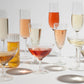 Puzzle image - Many different wine and stemmed cocktail glasses filled with champagne in different colors.