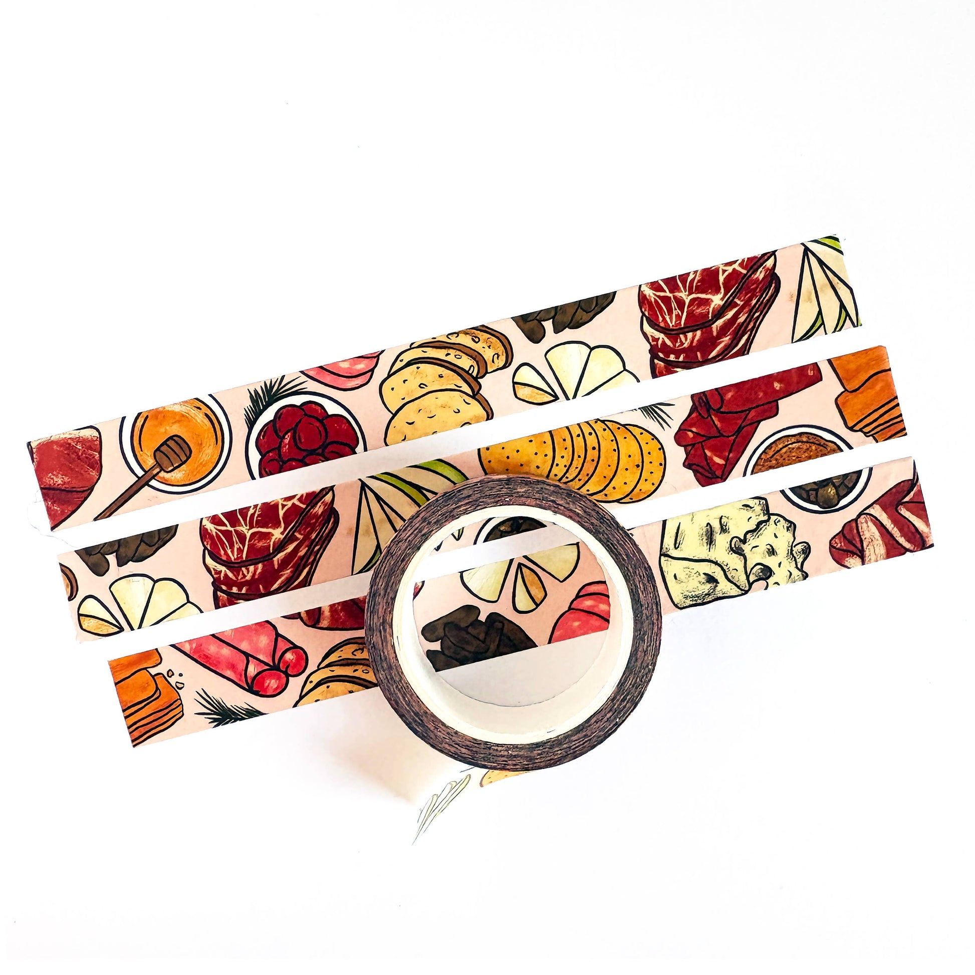 Washi tape that features a repeating pattern of cheese, charcuterie and accoutrements