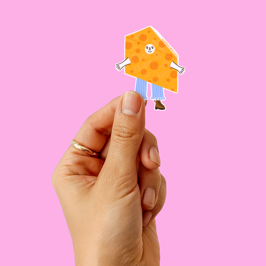 sticker of a cartoon cheese character being held by a hand 