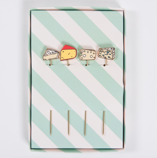 Set of cheese-themed cocktail picks on a striped card