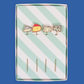 Set of cheese-themed cocktail picks in a striped box on a blue background