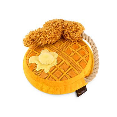 Yellow waffle-shaped plush toy with a plush fried chicken attached to a rope on a white background