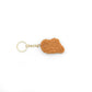chicken nugget shaped keychain on a white background