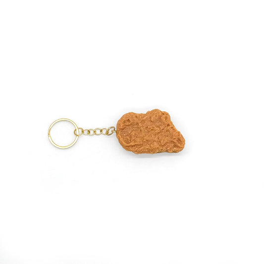 chicken nugget shaped keychain on a white background