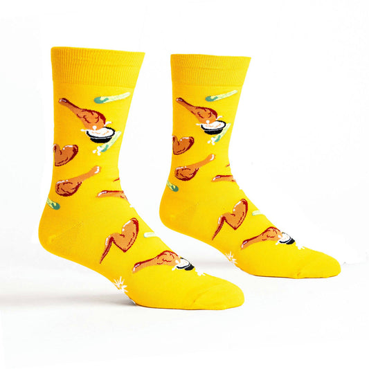 bright yellow socks with fried chicken wings, celery sticks and bleu cheese all over it 