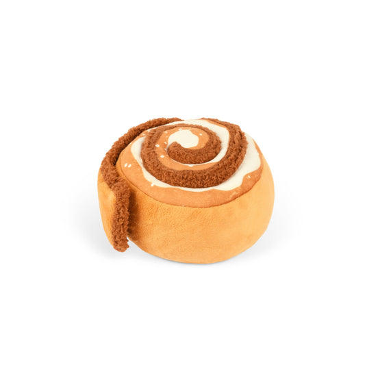 Cinnamon roll-shaped plush dog toy on a white background