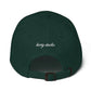Back of the cap showing adjustable strap and logo called KIRTY STUDIO.