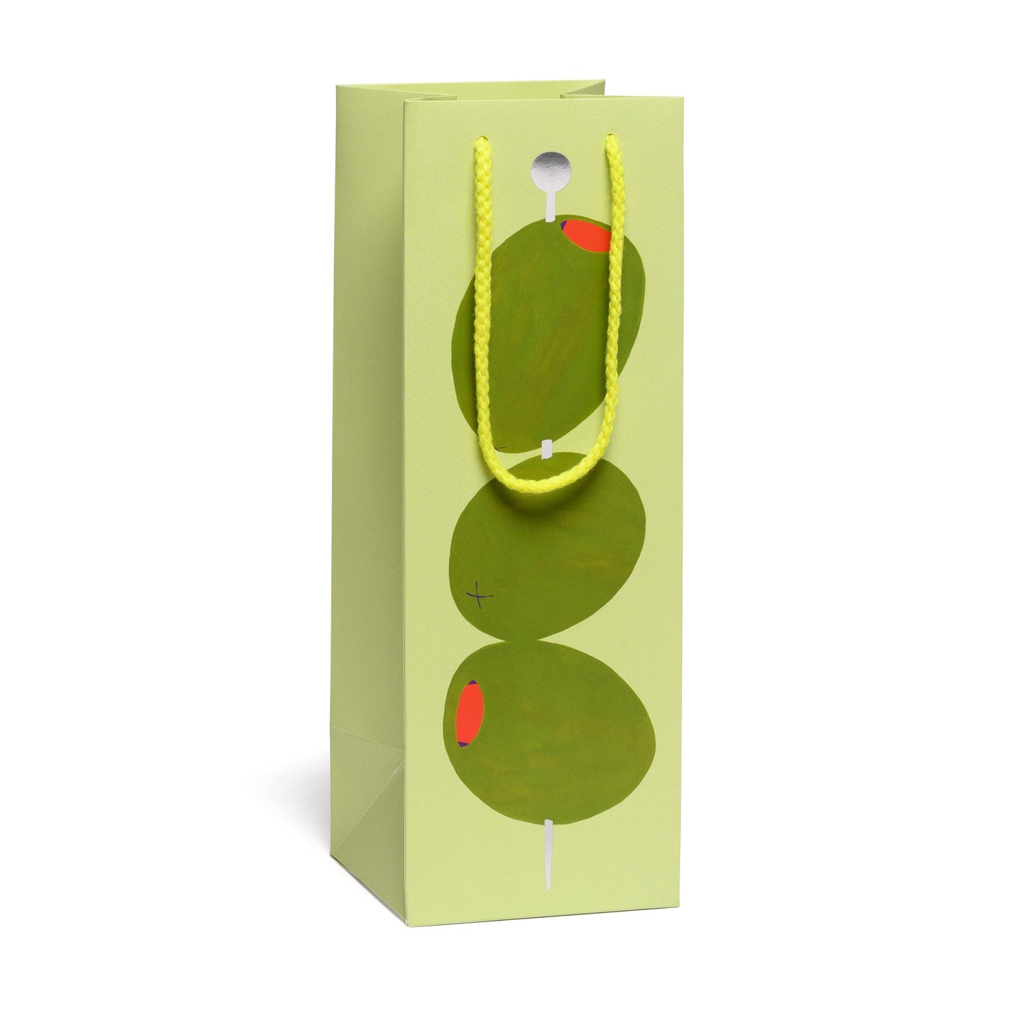 Green gift bag with 3 cocktail olives on a pick with a yellow handle on a white background