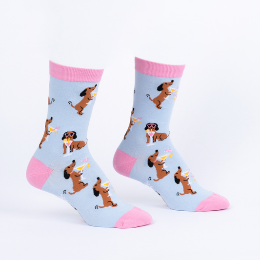 pink and blue socks with a dog holding a cocktail and wearing sunglasses 