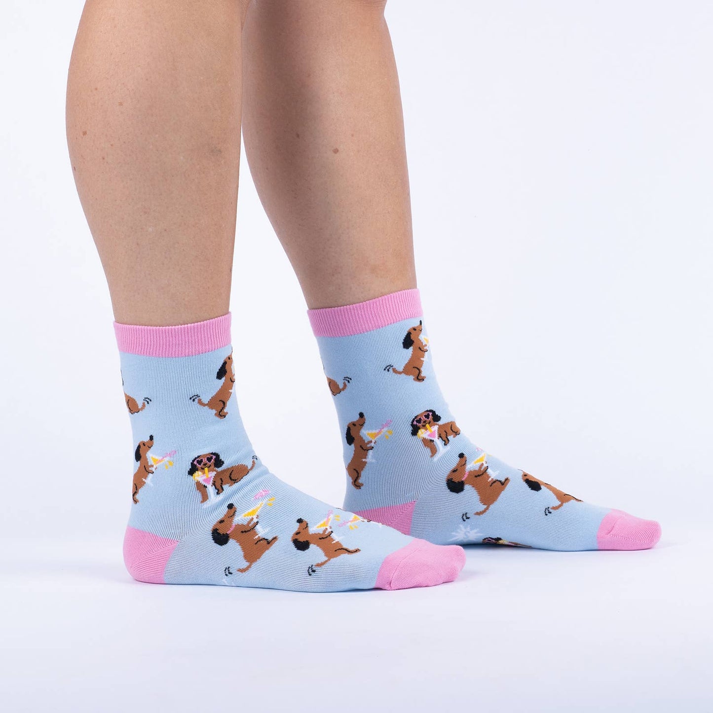 pink and blue socks with a dog holding a cocktail and wearing sunglasses 