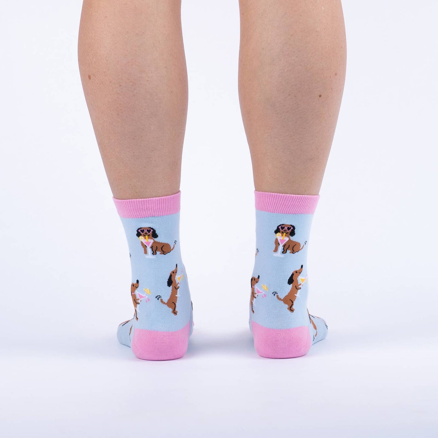 pink and blue socks with a dog holding a cocktail and wearing sunglasses 