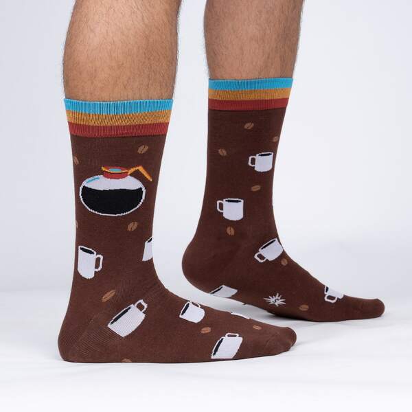 Brown socks with coffee-themed design worn by a person on a white background