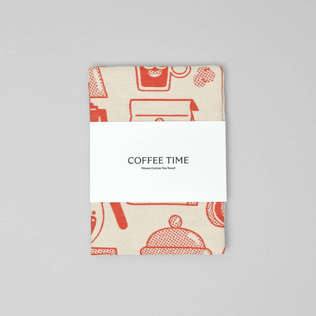 Kitchen towel with red coffee-themed design on a gray background