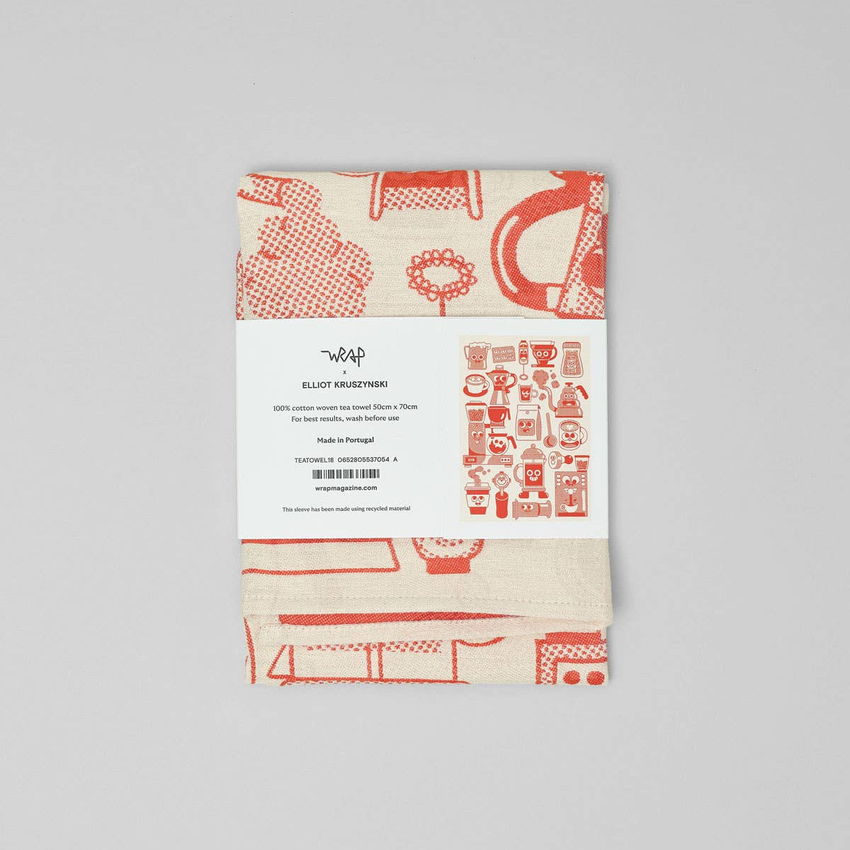 Kitchen towel with red and black pattern on a white background